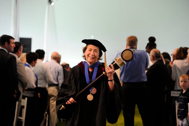 Associate Vice Provost for Gender and Equity Judith Ockene, PhD, recipient of the 2013 Chancellor’s Medal for Distinguished Service, carries the mace.