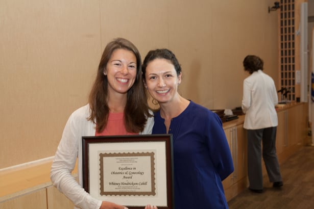 Dawn S. Tasillo, MD, presents the Excellence in Obstetrics & Gynecology Award to Whitney Hendrickson-Cahill.