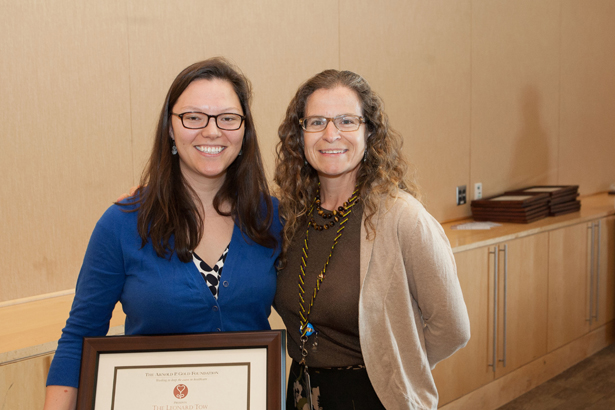 Melissa A. Fischer, MD, right, gives the Leonard Tow Humanism in Medicine Award presented by The Arnold P. Gold Foundation to Emily Chen.