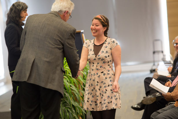 Cansu Colpan, of the Zamore lab, is congratulated by GSBS Dean Anthony Carruthers.
