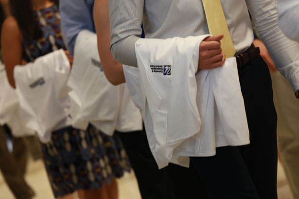 The Class of 2018 white coats were donated by the Class of 2014.