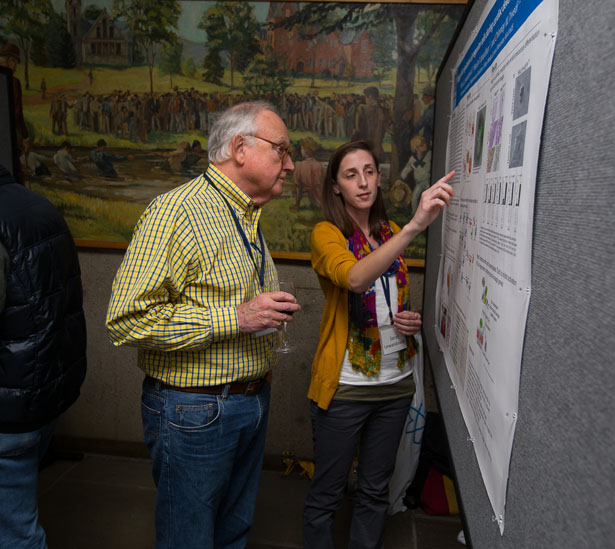 GSBS student Sarah Lewandowski discusses her poster with Thoru Pederson, PhD, professor of biochemistry & molecular pharmacology and one of the meeting organizers at the 19th Annual Research Retreat.