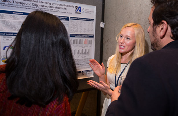 Maire Osborn, a postdoctoral fellow in the RNA Therapeutics Institute, speaks with Dinah Sah, PhD, left, an executive at Voyager Therapeutics, and Christian Mueller, PhD, assistant professor of pediatrics.