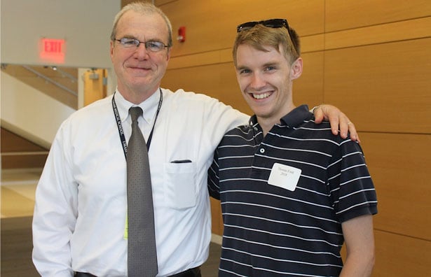 School of Medicine Dean Terence R.Flotte chats with Thomas Ford, a second-year student who attended the picnic to welcome the Class of 2019.