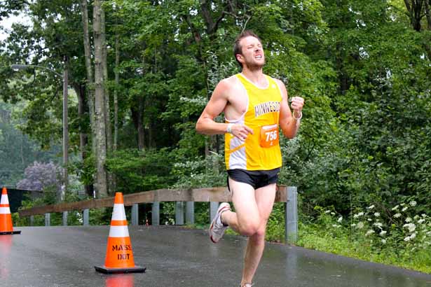 Luke Walker, 28, of Somerville, winner of the Governor Cellucci Tribute Road Race, crosses the finish line.