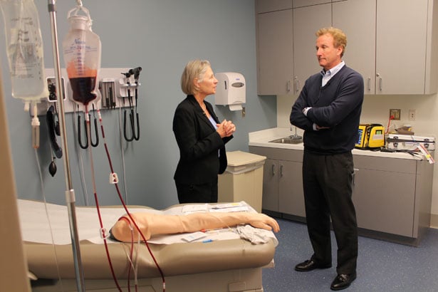 Michele Pugnaire with Chronicle’s Anthony Everett in an iCELS’ standardized patient simulation rooms. 