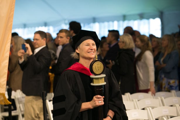 Chancellor’s Medal Winner Michele Pugnaire, MD, carries the University mace.