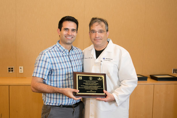 John Madore received the Association of Academic Surgery Student Research Award from Dr. Cahan.