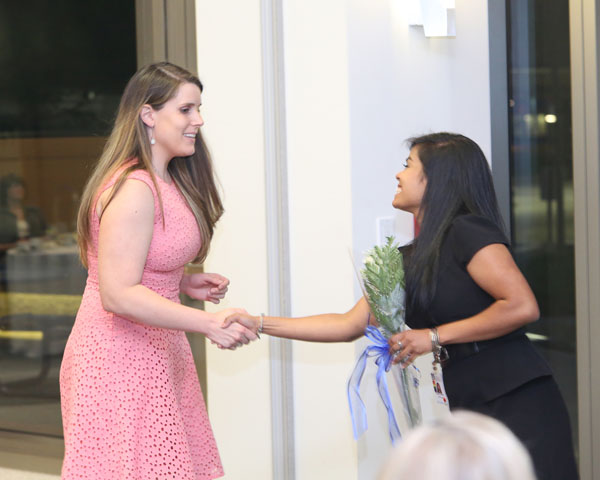 The ceremony closes with each graduate receiving a rose from members of the GSN Graduate Student Nursing Organization.