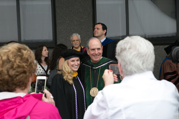 GSN graduate Caroline Kane, MS, pauses for a picture with Chancellor Collins.