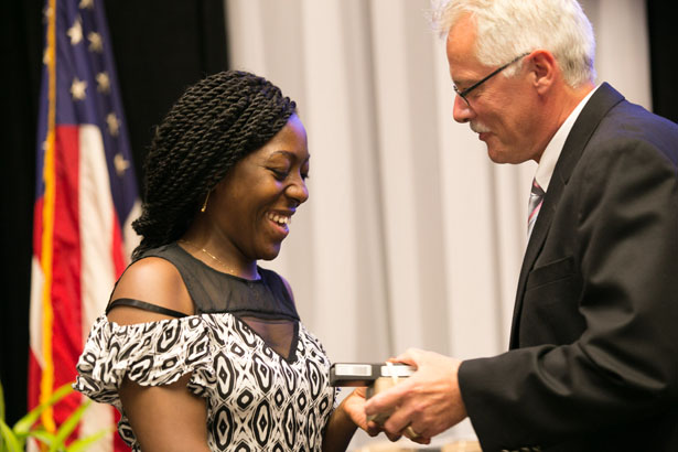 Larisa Kamga, a student in the Luzuriaga lab, with Dean Carruthers.