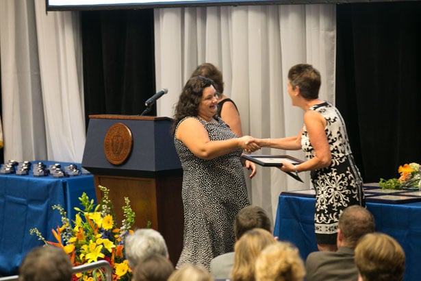 Estela Trebicka accepts the Spirit of Nursing Award from Dr. Terrill.
