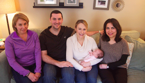 Left to right, New England Newborn Screening lab technician Melody Rush, Mike Salvi, Charlene Salvi, holding baby Juliana, and Inderneel Sahai, MD.