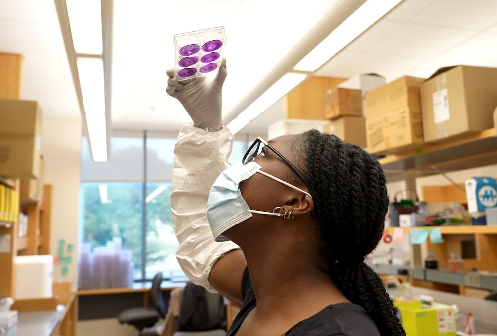 student in research lab