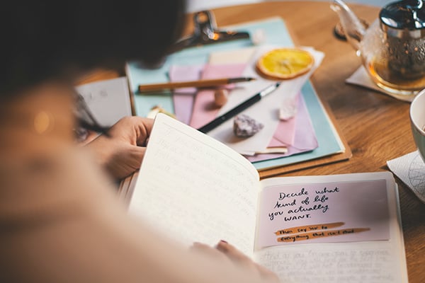 photo of person flipping through notebook