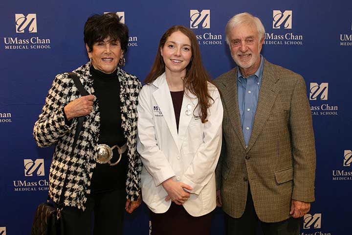 Sue and Rick Seder flank student speaker Sarah Danforth, a member of the Class of 2024.
