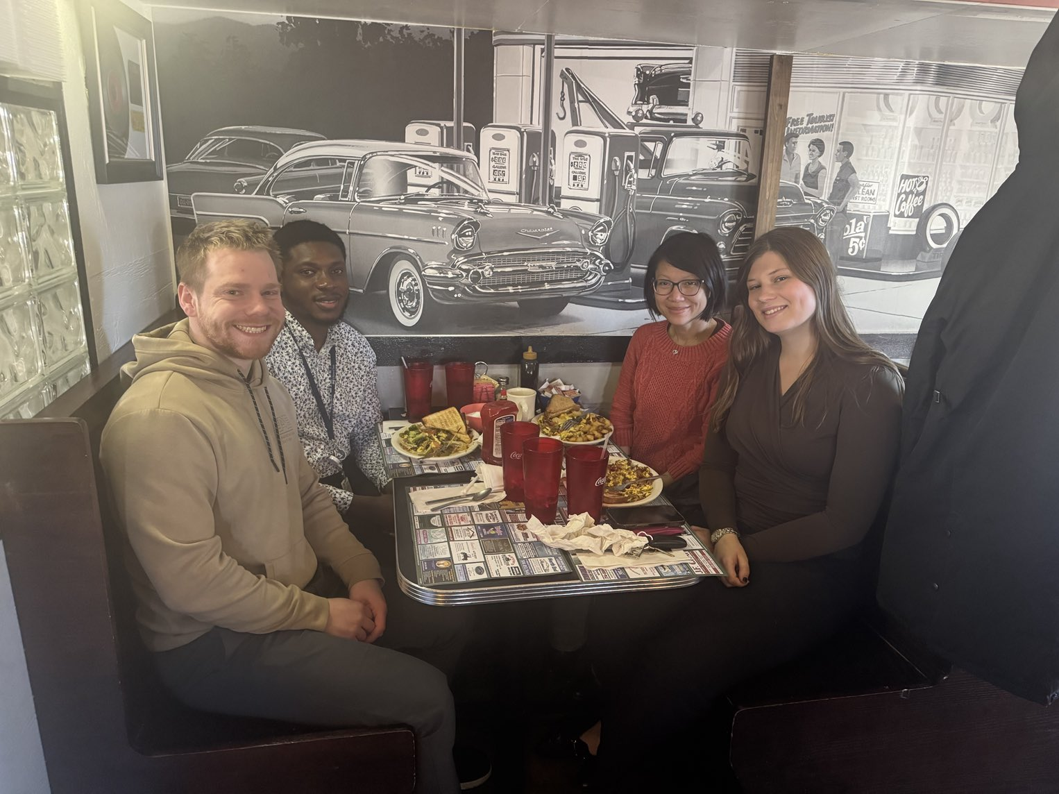 Members of the Tran lab celebrating their R01 award by going out to breakfast