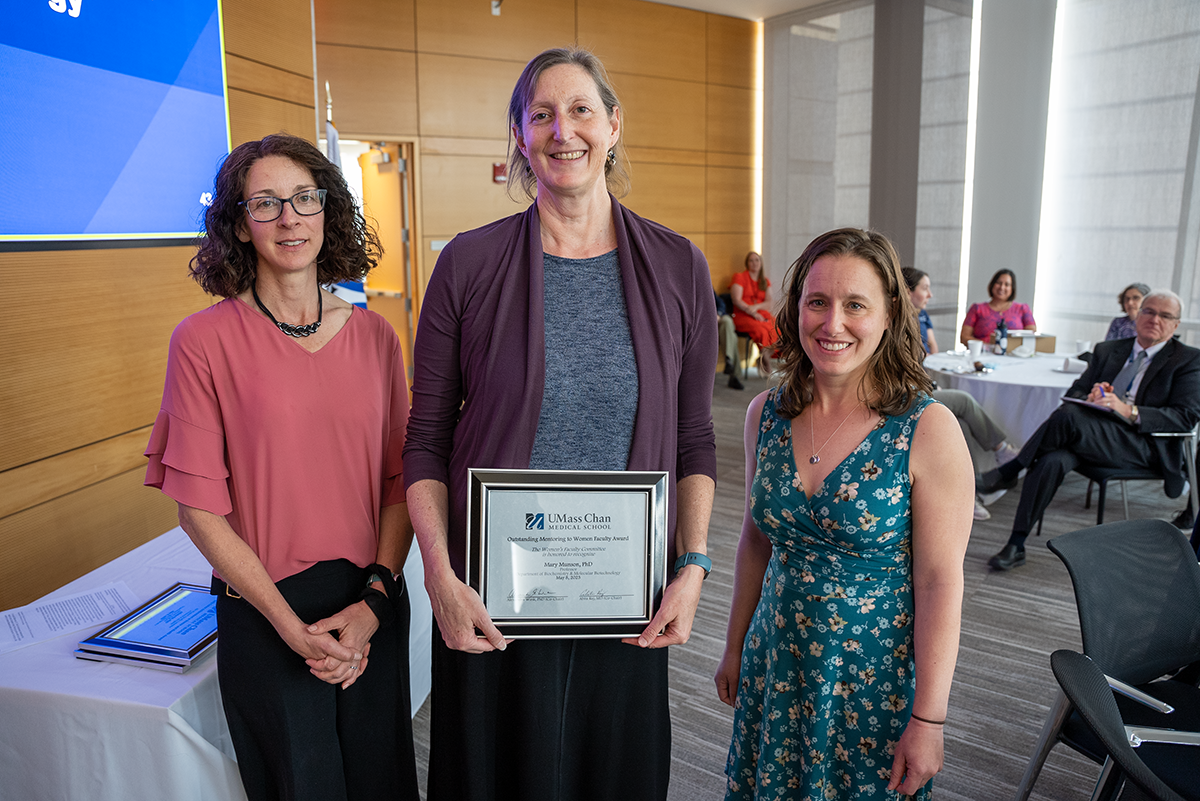 Dr. Mary Munson being awarded by representatives of the Women's Faculty Committee