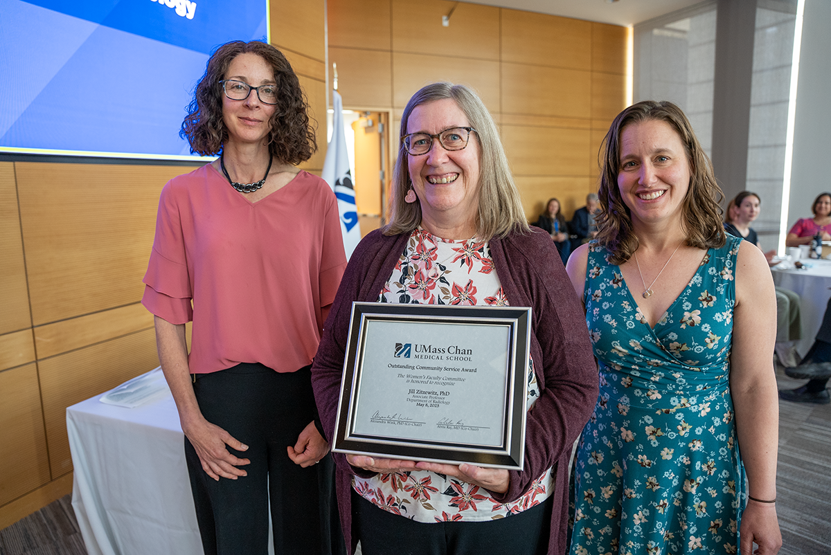 Dr. Jill Zitzewitz being awarded by representatives of the Women's Faculty Committee