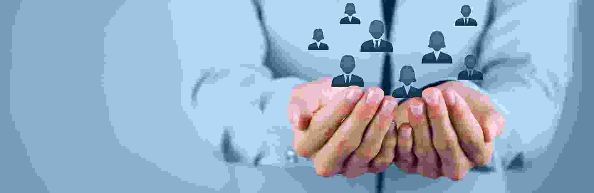 Hands of a care manager holding people icons