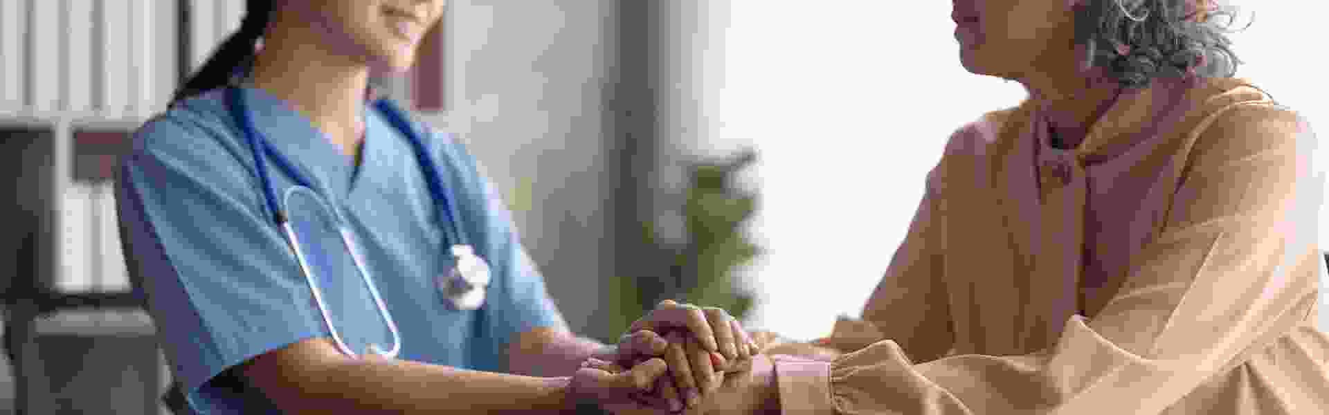 doctor holding a patient's hands