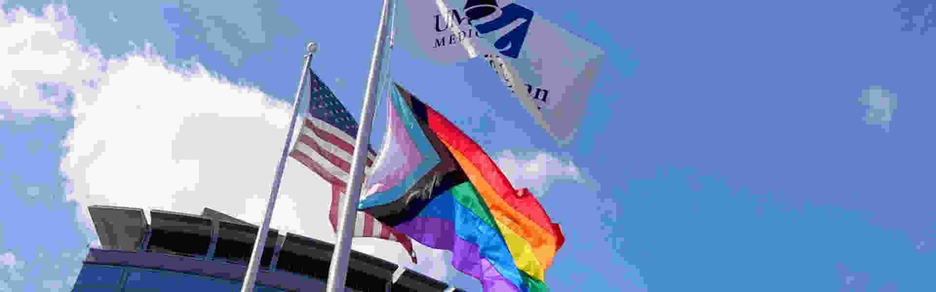 Photo of American, UMass Chan, and Pride flags on UMass Chan campus