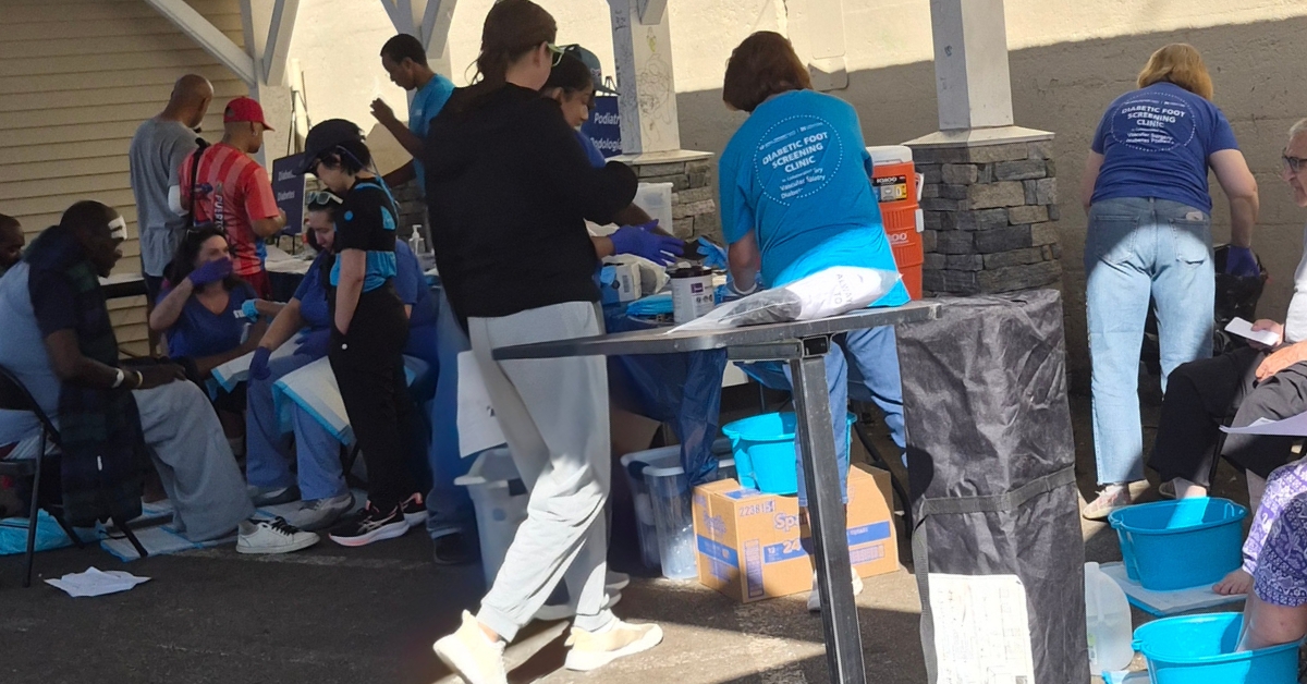 volunteer providers helping community members under the tent at the clinic in Worcester in June of 2026