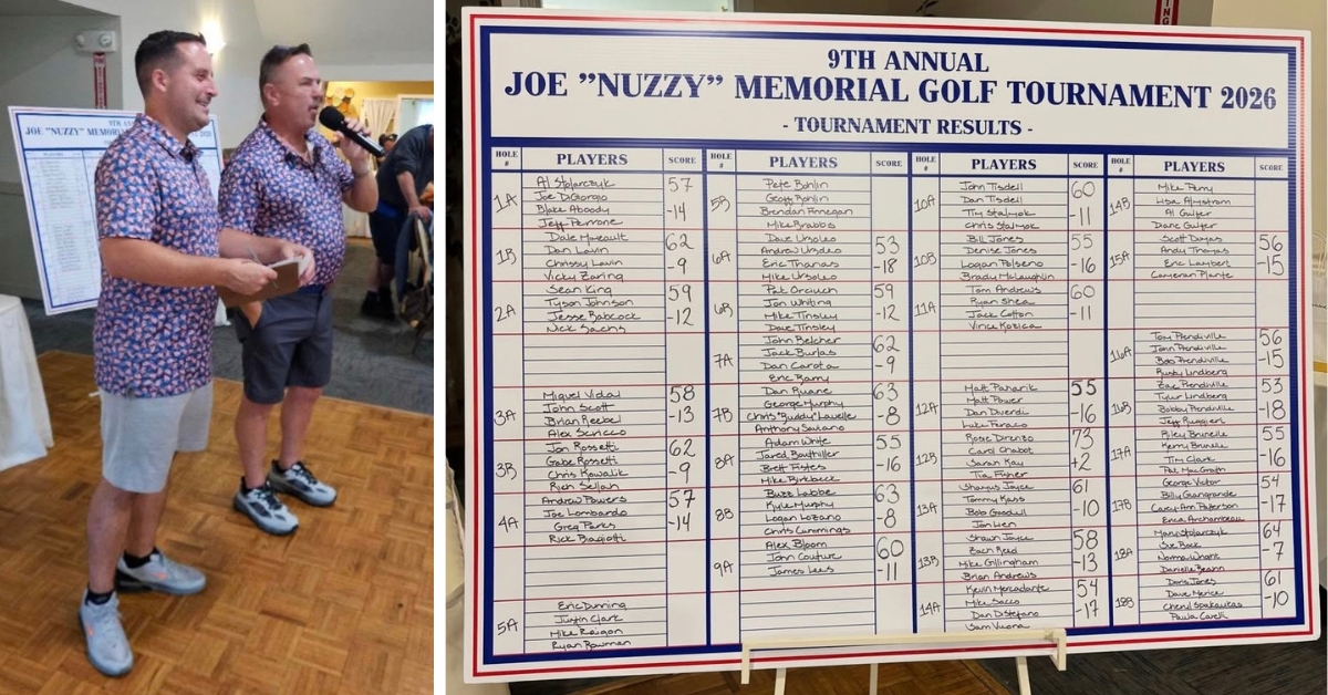 Joe's friends thanking participants on the mic next to the board with all of the teams and participant names for the 2026 event
