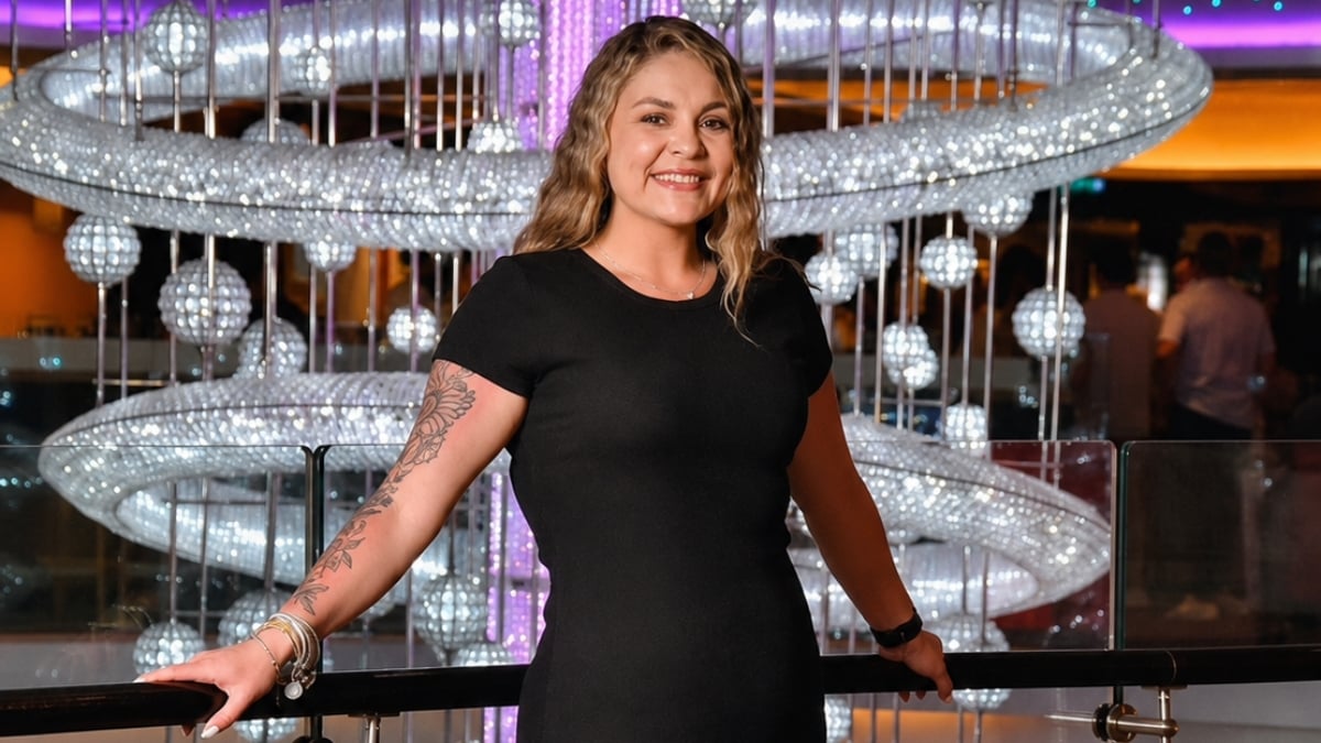 Azlynm standing in a cruise ship atrium