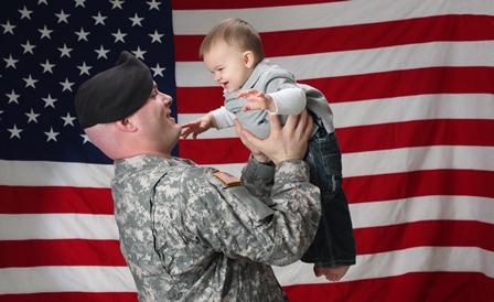 American soldier holds his infant son