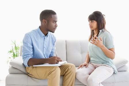 man therapist talking with woman