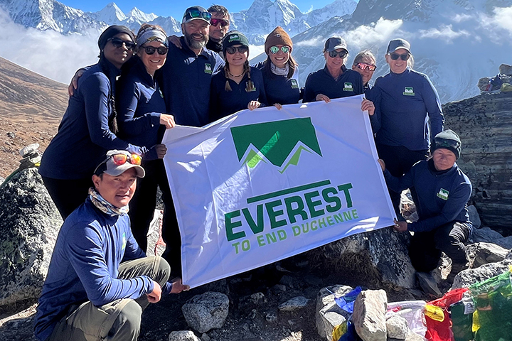 The 2024 Everest to End Duchenne team takes a break during their trek through the Himalayan Mountains.