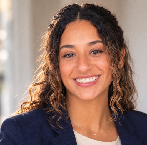 brown young woman with curly hair