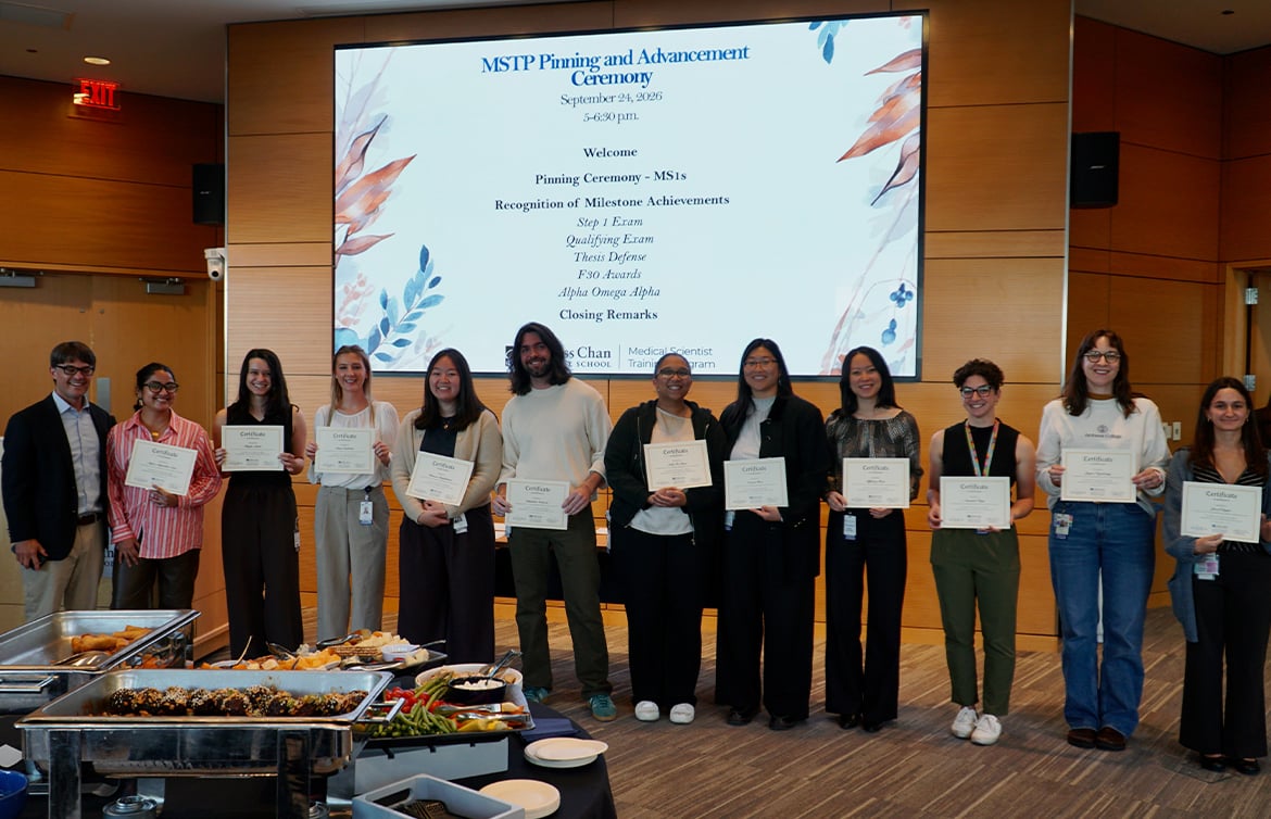 MD-PhD students receiving certificates for passing Step 1 exam