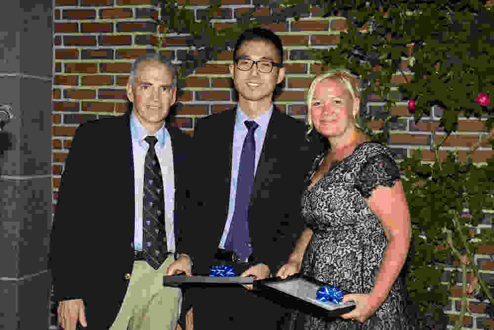 Dr. Makris honors Chief Residents Dr.s Heesop Shin, and Monique Tyminski