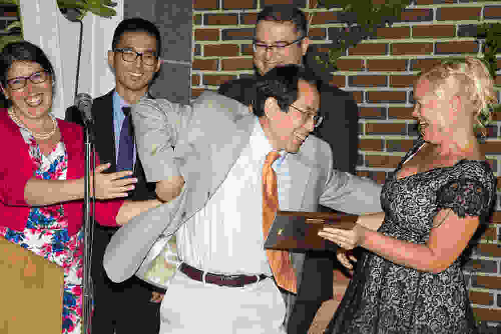 Radiology Residents present Dr. Larry Zheng with the Teacher of the Year award