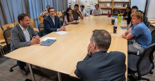  Lab around boardroom table 2026.png