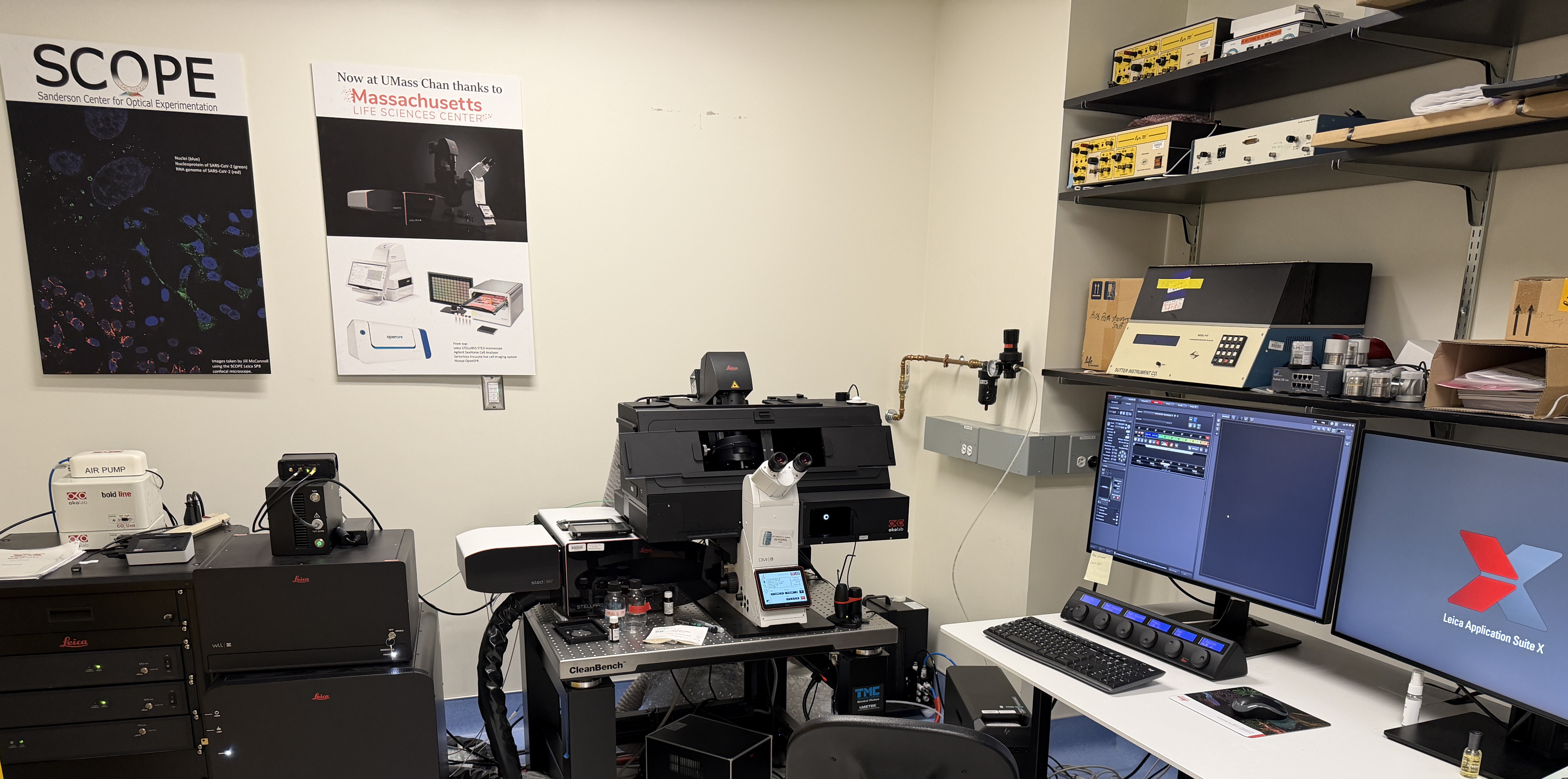 Stellaris 8 STED at SCOPE UMass Chan. Instrument and workstation are shown. Poster giving MLSC funding credit is shown above the instrument