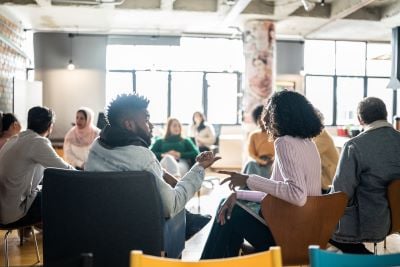 diverse group of people in a therapy meeting