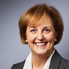 white middle aged woman with short reddish hair