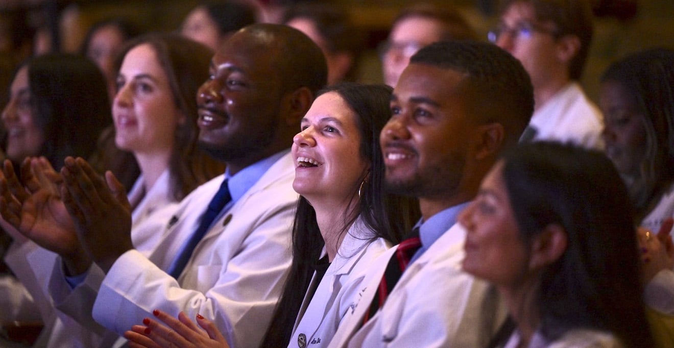Medical students clad in new white coats