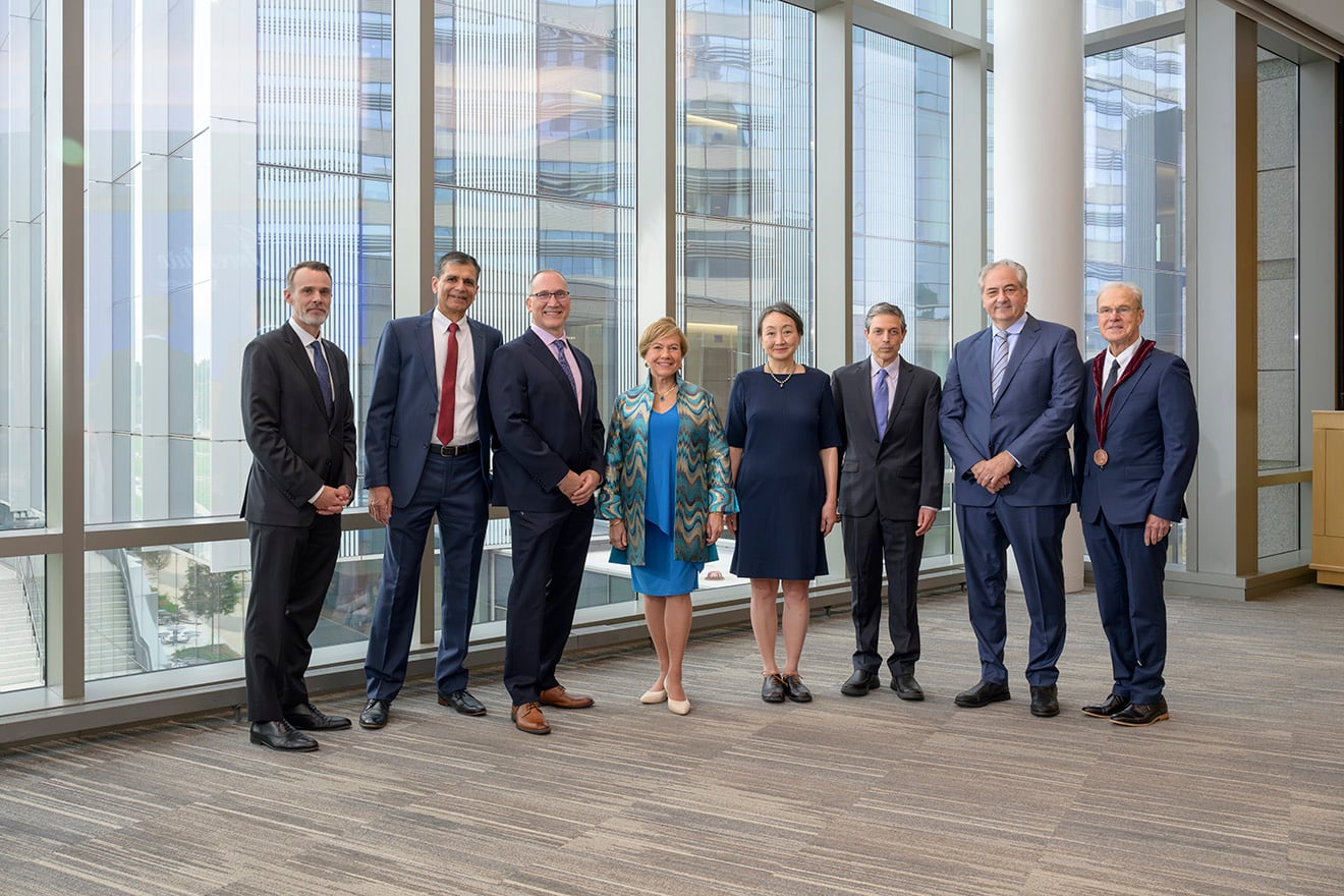 : Chancellor David McManus (far left) and Terence R. Flotte, MD (far right) pose for a photo with the newly endowed professors, Samir Malkani, MD; Edwin D. Boudreaux, PhD; Johanna M. Seddon, MD, ScM, FARVO, FASRS; Jennifer Wang, MD; Andrew R. Tapper, PhD; and David Michael Dosa, MD, MPH