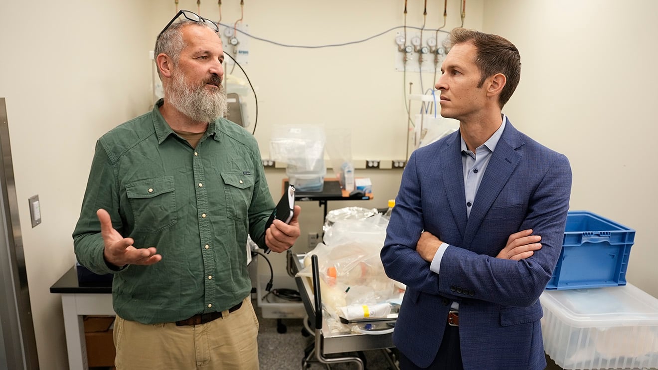 Sylvain Cecchini, PhD, speaks with Congressman Jake Auchincloss during a tour of UMass Chan Medical School