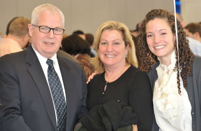 SOM graduating senior Alex Moore with her parents.