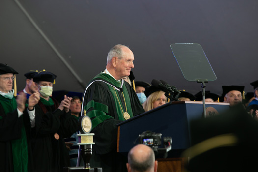 Chancellor Michael F. Collins greets the graduates and their guests.