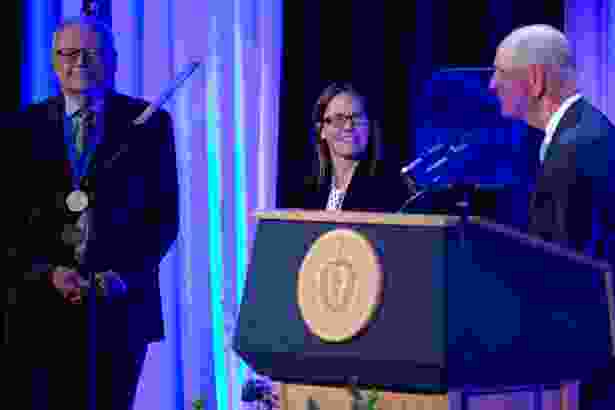 Beth A. McCormick, PhD, is invested as the Worcester Foundation for Biomedical Research Chair by Thoru Pederson, PhD, left, and Chancellor Michael F. Collins.