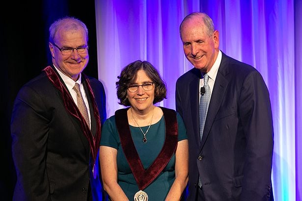 Celia A. Schiffer, PhD, is invested as the Gladys Smith Martin Chair in Oncology by Dean Terence Flotte and Chancellor Collins.