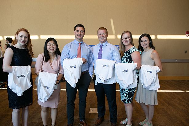 Members of the School of Medicine Class of 2023 gather before the White Coat Ceremony.
