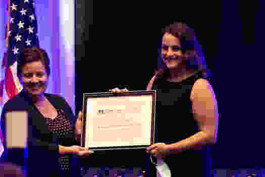 Jesica Pagano-Therrien, PhD, presents Academic Excellence Award to Maria Karamourtopoulos.
