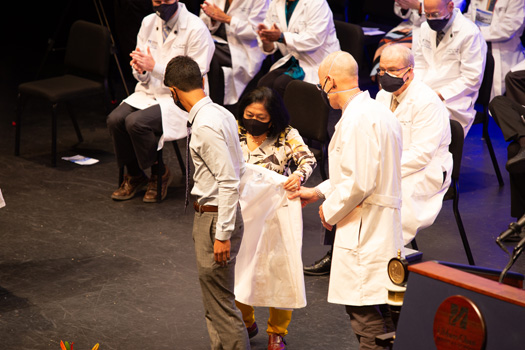 First-year medical student Zahin Ahmed was the first to receive one a white coats bearing the new school name.